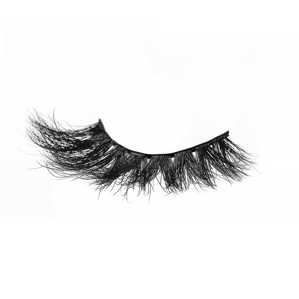 On a white background, beautiful black eye lashes called Betty Luxury Mink Lashes in a flare shape. 18mm length. medium volume. Material : Mink. Bold Effect.
