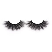On a white background, beautiful two black eye lashes called Cassandra Faux Mink Lashes in a round shape. 20mm length. natural volume. Material : Silk