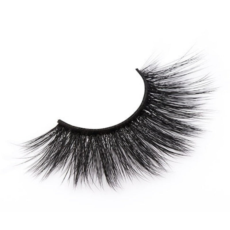 On a white background, beautiful  black eye lashes called Cassandra Faux Mink Lashes in a round shape. 20mm length. natural volume. Material : Silk